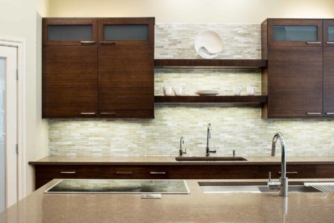Bamboo cabinet Tulsa kitchen island, Galley sink workstation, Wolf induction cooktop, undermount sink, open shelves, tile backsplash Tulsa kitchen design and remodel