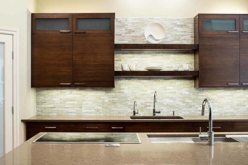 Bamboo cabinet Tulsa kitchen island, Galley sink workstation, Wolf induction cooktop, undermount sink, open shelves, tile backsplash Tulsa kitchen design and remodel