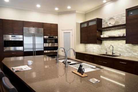 Bamboo cabinet Tulsa kitchen Galley Workstation, Wolf induction cooktop, quartz counters, undermount sink, storage, Wolf steam oven, Sub-Zero french door refrigerator Tulsa kitchen remodel
