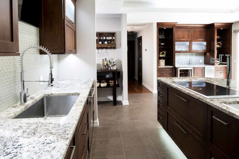 Brown kitchen remodel cabinets, granite counter-top, tile flooring, large island drawer storage, clean-up sink, Galley sink, bar area ice wine Tulsa kitchen remodel