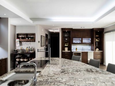 Kitchen design large island granite counter-top, Galley Workstation, bar area frosted glass wall cabinet storage, raised ceiling, island seating Tulsa kitchen remodel