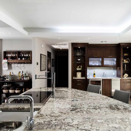 Kitchen design large island granite counter-top, Galley Workstation, bar area frosted glass wall cabinet storage, raised ceiling, island seating Tulsa kitchen remodel