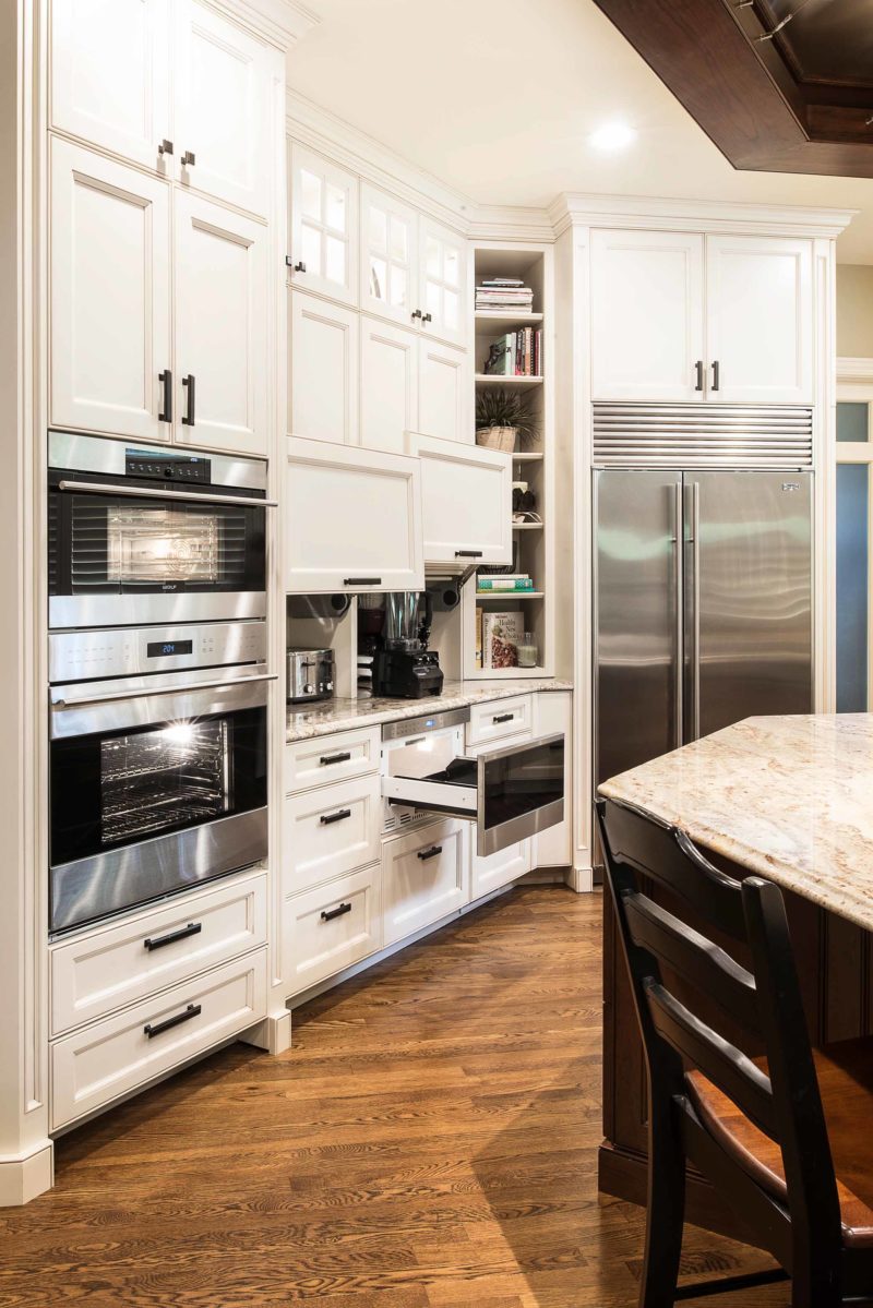 Kitchen drawers appliance storage, Wolf drawer microwave, Wolf double ovens, Sub-Zero freezer refrigerator, cabinet storage, kitchen island, wood floors Kitchen Ideas Tulsa kitchen remodel