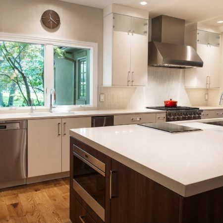 Large open kitchen remodel quartz counter-tops, white flat panel cabinets, stainless dishwasher, large island, drawer microwave, induction cooktop, Galley Workstation Tulsa kitchen remodel