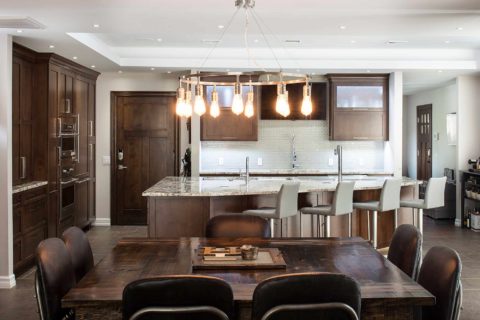 Open Tulsa kitchen remodel, dark brown cabinet storage, granite counters, tile backsplash, Galley Workstation, island pendants, clean-up sink, dining table Kitchen Ideas Tulsa kitchen design