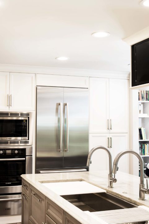 Stainless refrigeration and ovens, tall cabinet storage, Galley Workstation Kitchen Ideas Tulsa kitchen design and remodel