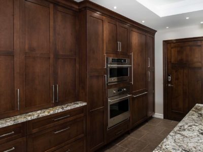 Tulsa kitchen tall pantry storage, GE Monogram microwave and oven, pull-out base storage, brown cabinets Kitchen Ideas Tulsa kitchen remodel