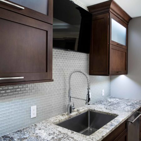 Undermount kitchen sink, ceramic tile backsplash, dark brown pull up wall cabinet storage, frosted glass fronts, stainless dishwasher Kitchen Ideas Tulsa kitchen design and remodel