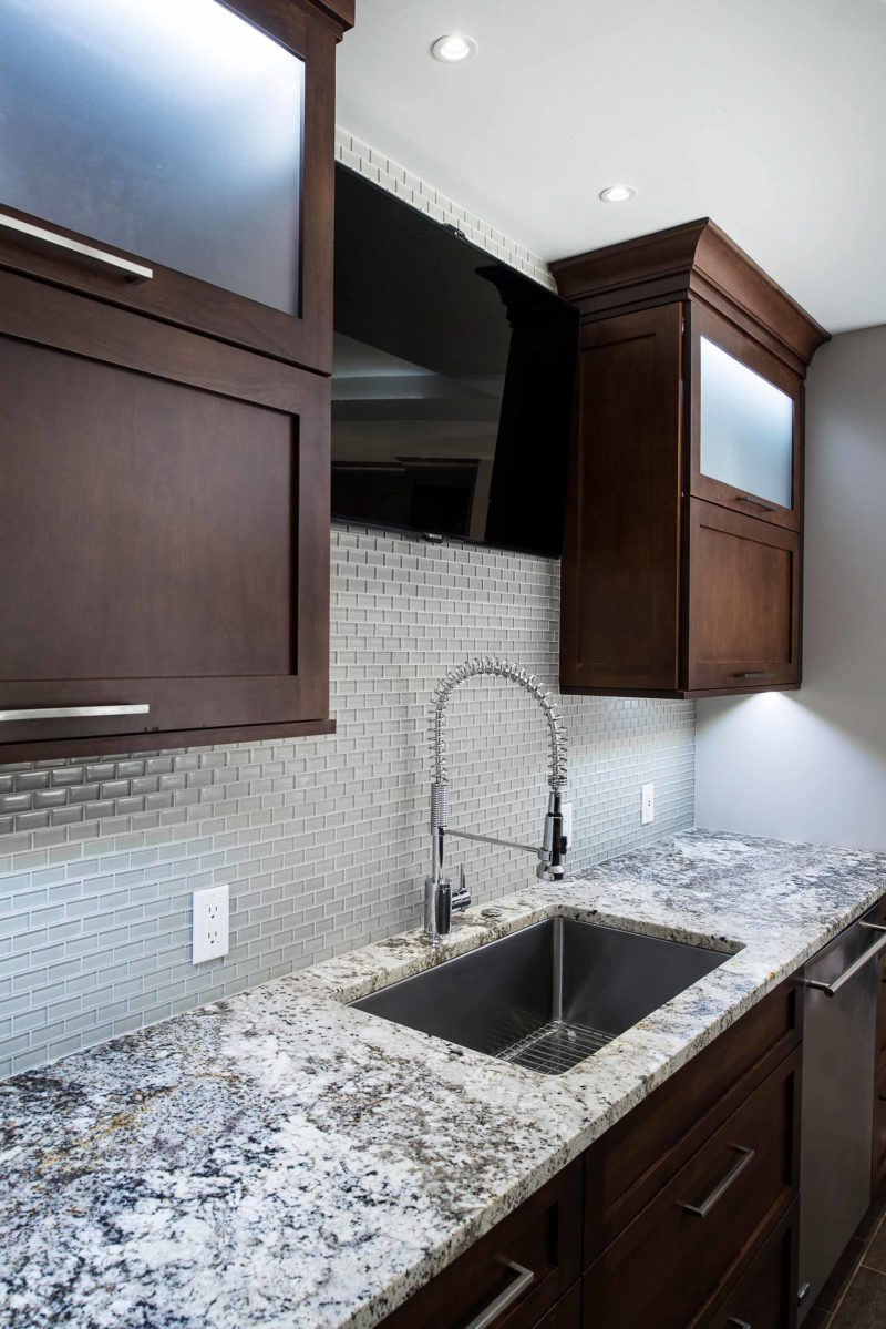 Undermount kitchen sink, ceramic tile backsplash, dark brown pull up wall cabinet storage, frosted glass fronts, stainless dishwasher Kitchen Ideas Tulsa kitchen design and remodel