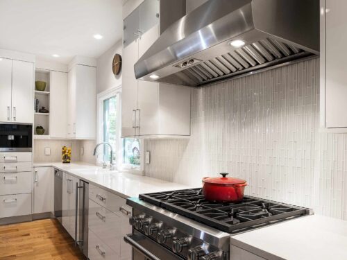 Tulsa kitchen gas range cooking, stainless ventilation, white cabinets, ceramic tile backsplash, Miele coffee, base drawer wall storage Tulsa kitchen remodel