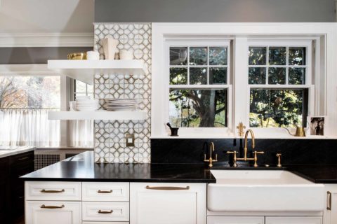 Tulsa kitchen remodel featuring an apron-front clean-up kitchen sink, an Ann Sacks Nottingham tile backsplash, and open shelving.