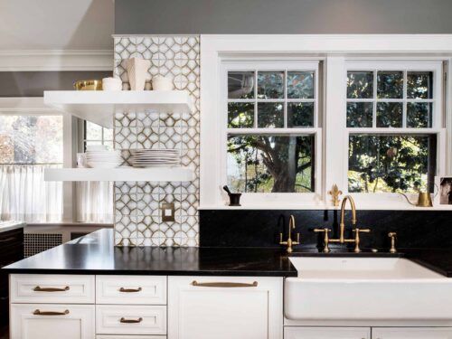 Tulsa kitchen remodel featuring an apron-front clean-up kitchen sink, an Ann Sacks Nottingham tile backsplash, and open shelving.