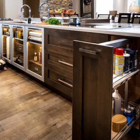 Kitchen island base pullout cabinet, island drawer storage, luxury vinyl wood flooring, Galley Workstation, Wolf induction cooktop Tulsa kitchen design and remodel