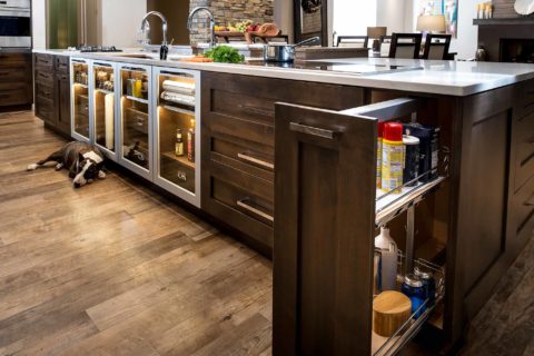 Kitchen island base pullout cabinet, island drawer storage, luxury vinyl wood flooring, Galley Workstation, Wolf induction cooktop Tulsa kitchen design and remodel
