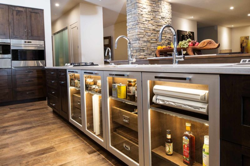Kitchen island glass storage, Galley sink workstation, vinyl plank flooring, Wolf convection steam ovens, cabinet storage Tulsa kitchen remodel