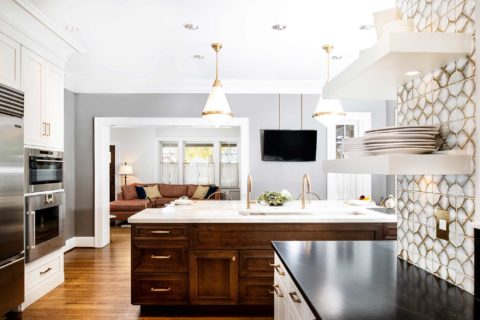 Midtown Tulsa kitchen design island Galley Workstation, red birch cabinet drawer storage, pendant lights, Ann Sacks tile backsplash, floating shelves Tulsa kitchen design remodel
