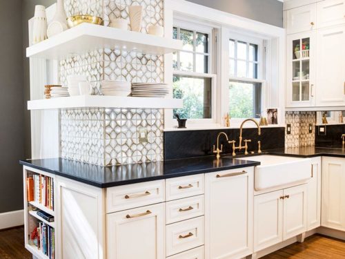Beautiful midtown Tulsa kitchen with farmhouse cleanup kitchen sink, Ann Sacks Nottingham tile backsplash, open shelving and maple cabinets with melted brie painted finish