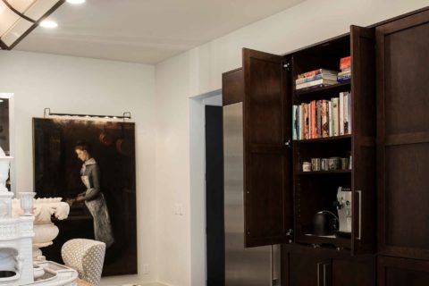Tulsa kitchen design and remodel with tall pantry storage, coffee center and cookbook storage surrounded by stainless all refrigerator/freezer