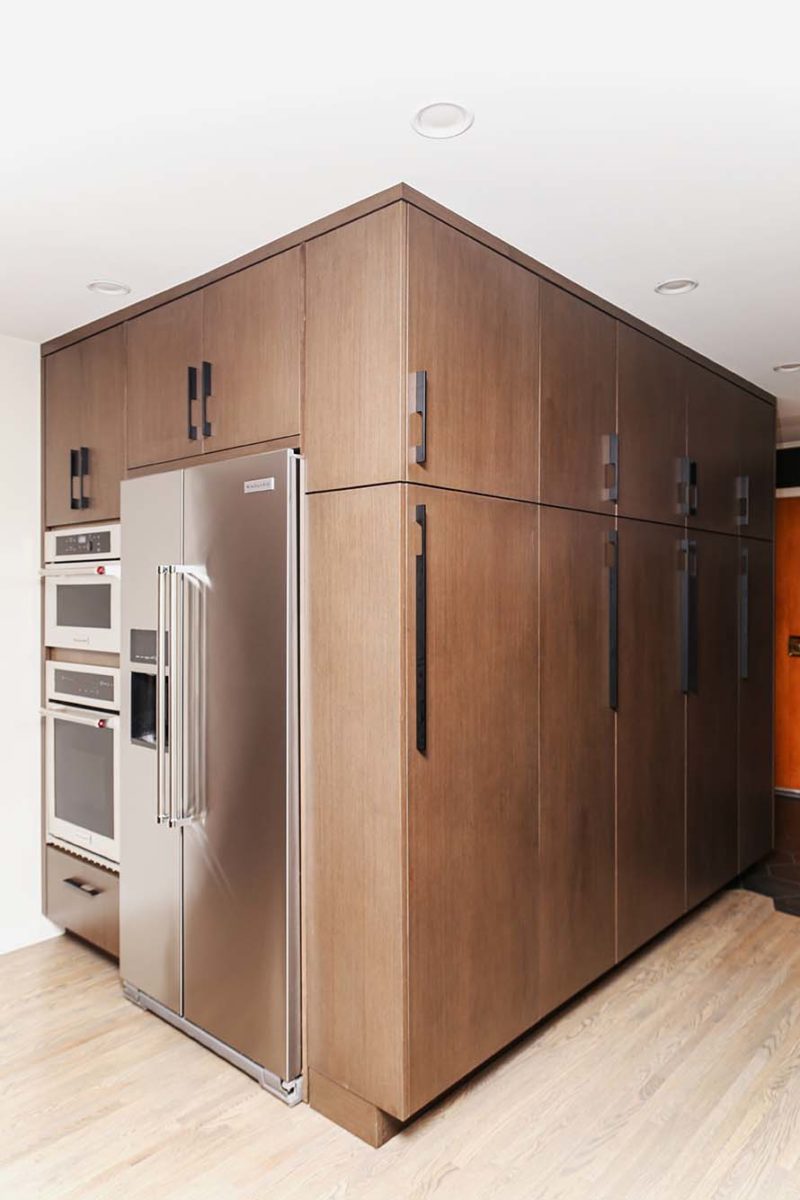 Tall kitchen cabinet storage with Kitchenaid stainless ovens freezer refrigerator
