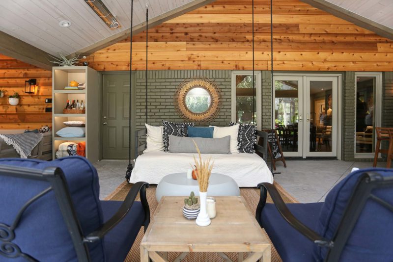 Open spacious Tulsa patio design and remodel living area with concrete flooring and vaulted ceiling