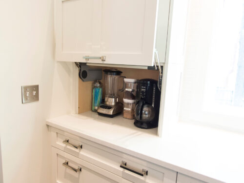 Tulsa kitchen remodel featuring a coffee and beverage center with pull-up cabinet storage, ample counter space, and a quartz countertop.