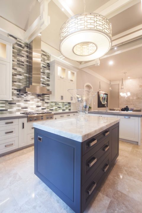 Small kitchen island, decorative pendant light, cabinet storage, stainless appliances, vent hood, decorative backsplash tile Kitchen Ideas Tulsa kitchen remodel
