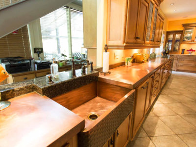 The First Love 5 open classic tuscan style kitchen with copper counter top and farmhouse sink