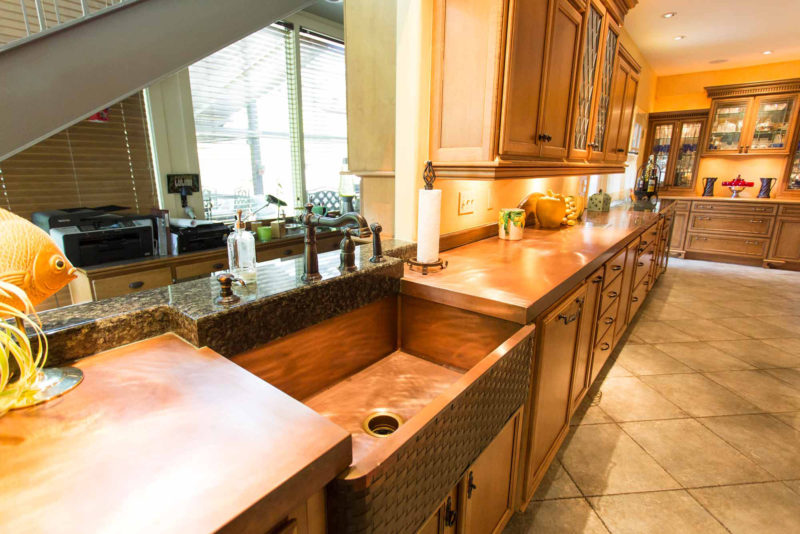 The First Love 5 open classic tuscan style kitchen with copper counter top and farmhouse sink