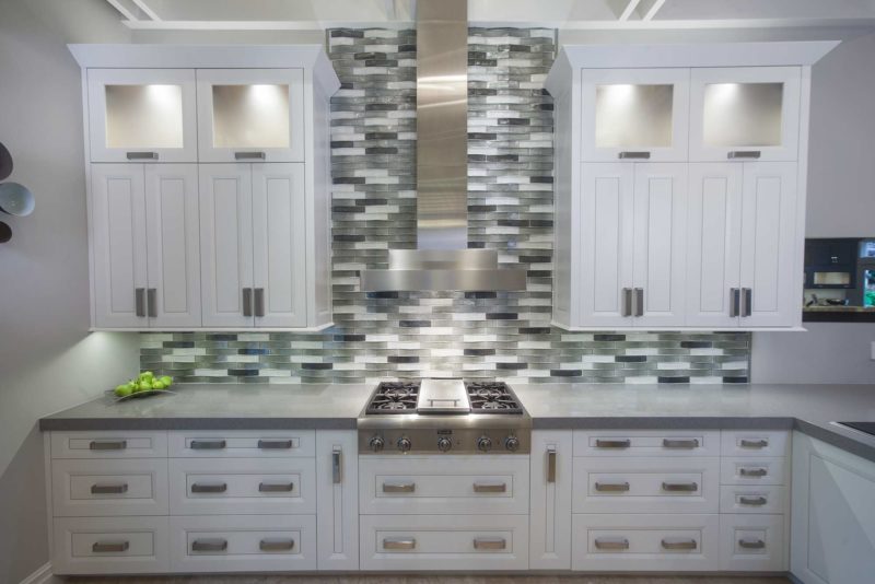 Thermador professional gas rangetop, stainless canopy vent hood, decorative subway tile backsplash, white cabinet storage Kitchen Ideas Tulsa kitchen remodel