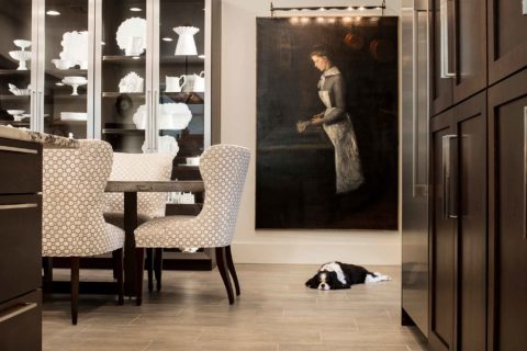 Kitchen remodel in Tulsa with adjoining dining room including tall storage for fine china, dining table and decorative tile flooring