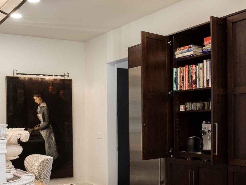 Tulsa kitchen remodel and design featuring tall pantry storage, a dedicated coffee and cookbook storage area, and a stainless steel all-refrigerator and freezer.