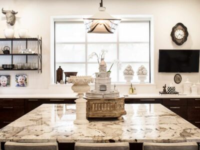 Tulsa kitchen remodel with quartzite and quartz counter-tops, island seating, rich-brown base cabinet storage and modern designed pendant lights