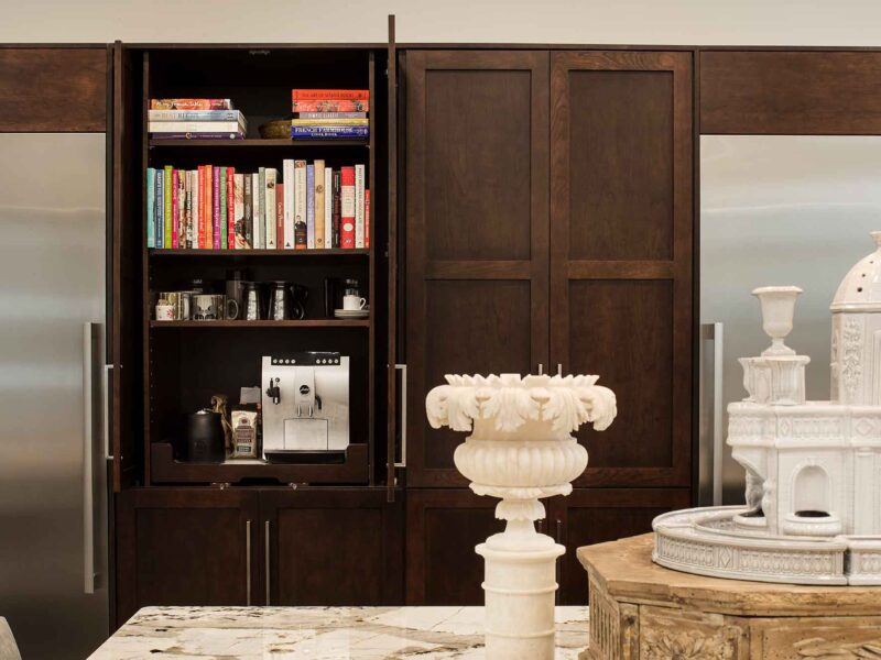 Tulsa kitchen remodel and design featuring tall pantry storage, a dedicated coffee and cookbook storage area, and a stainless steel all-refrigerator and freezer.