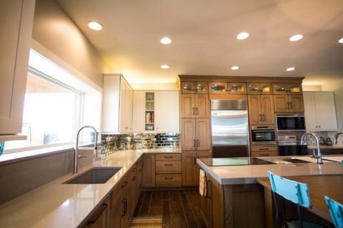 Tulsa kitchen design featuring a ranch-style kitchen remodel with an undermount clean-up sink, tall cabinet storage, Sub-Zero and Wolf appliances, a Galley Workstation, and island drawer storage.