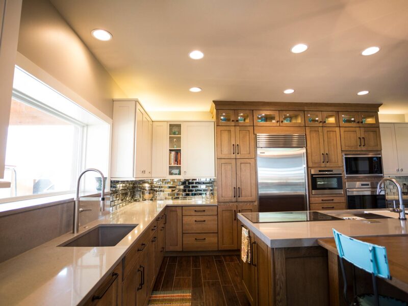 Tulsa kitchen design featuring a ranch-style kitchen remodel with an undermount clean-up sink, tall cabinet storage, Sub-Zero and Wolf appliances, a Galley Workstation, and island drawer storage.