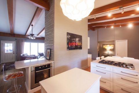 Undercounter oven space, gas cooktop, peninsula seating, wood floors, white cabinet drawer storage Kitchen Ideas Tulsa kitchen remodel