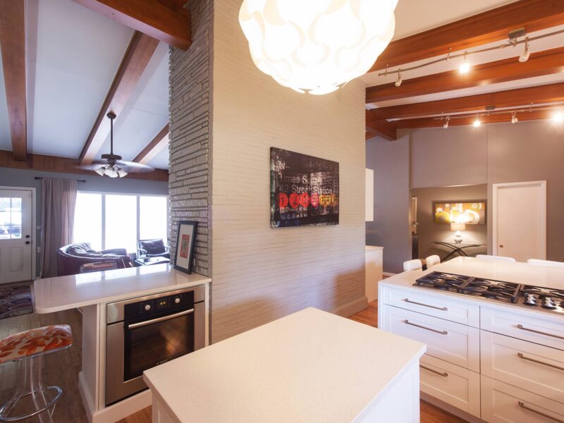 Undercounter oven space, gas cooktop, peninsula seating, wood floors, white cabinet drawer storage Kitchen Ideas Tulsa kitchen remodel