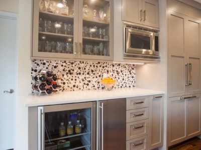 Kitchen beverage drawer space, microwave, under counter refrigerator, ice maker, wall cabinets beaded glass doors, paneled refrigerator freezer, wood floors Kitchen Ideas Tulsa kitchen remodel