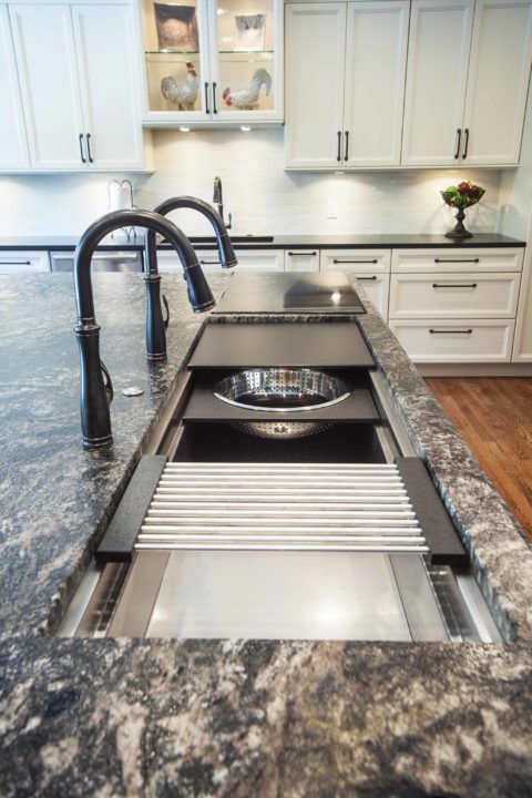 Galley Workstation granite island, induction cooktop, white cabinet storage, undermount sink, tile backsplash Kitchen Ideas Tulsa kitchen remodel