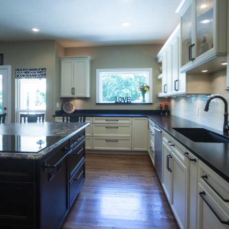 Kitchen island drawer storage, undermount kitchen sink, black counter tops, wood floors Kitchen Ideas Tulsa kitchen remodel
