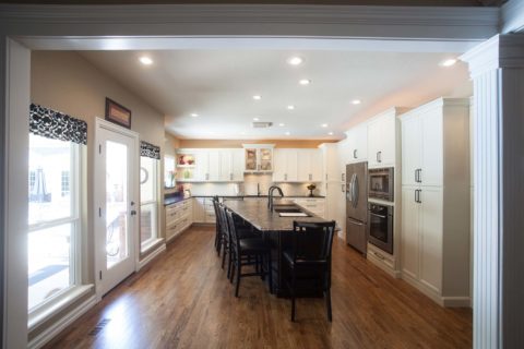 Open kitchen wood floors, white perimeter cabinets, brown island cabinets, Galley Workstation, induction cooktop, drawer door wall tall cabinet storage Kitchen Ideas Tulsa kitchen remodel