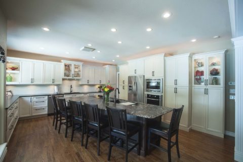 White kitchen cabinets and brown island cabinets, Galley Workstation undermount sink, tall pantry storage Kitchen Ideas Tulsa kitchen remodel