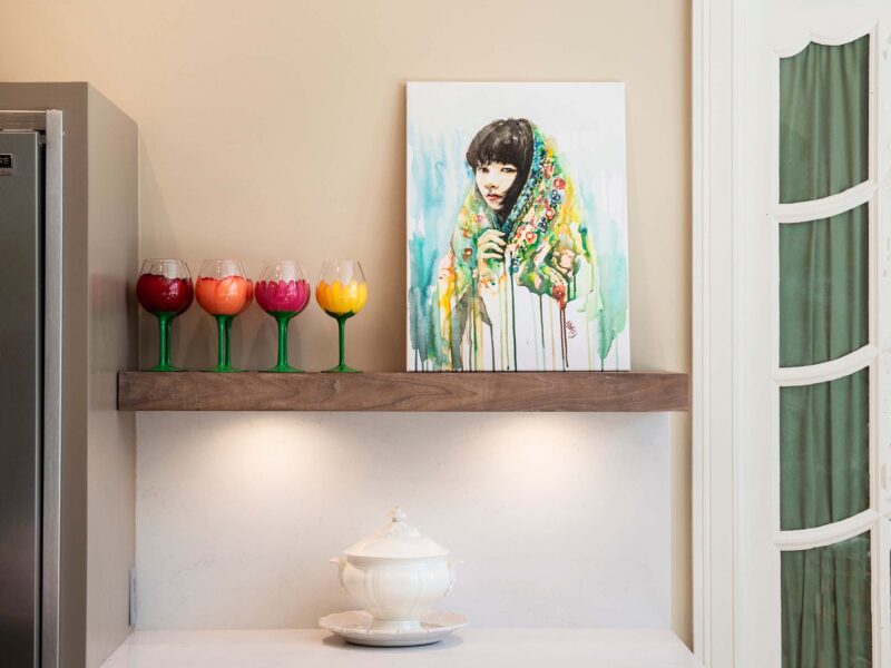 Tulsa kitchen remodel featuring a floating kitchen shelf, a Frigidaire all-freezer and refrigerator, an under-counter microwave, and quartz countertops.