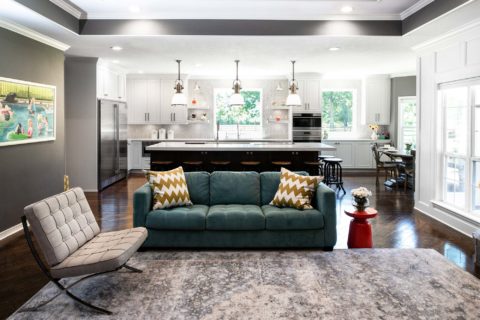 South Tulsa kitchen open to living room, island seating, Galley Workstation, induction cooktop, stainless appliances, decorative tile backsplash, clean-up sink, open shelves Tulsa kitchen remodel