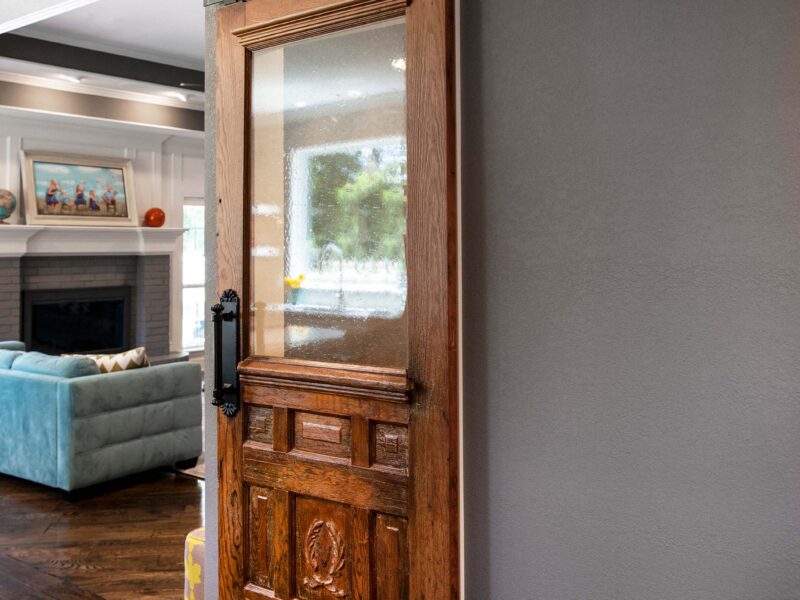 Tulsa kitchen remodel featuring a walk-in pantry with a custom sliding door.
