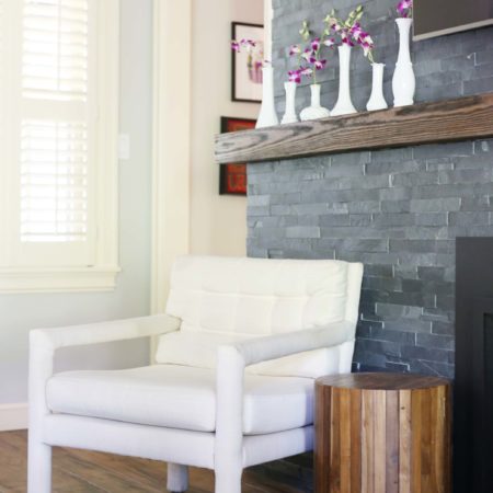 Brick fireplace wood mantle decoration space, wall mounted television, wood flooring Kitchen Ideas Tulsa living room design and remodel