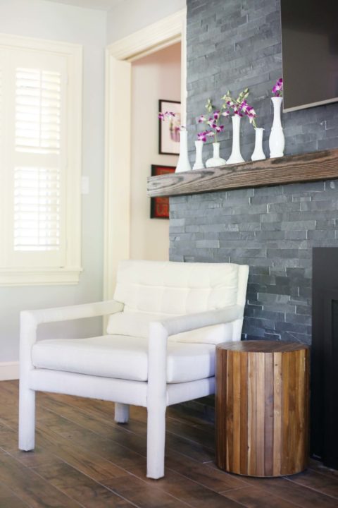 Brick fireplace wood mantle decoration space, wall mounted television, wood flooring Kitchen Ideas Tulsa living room design and remodel
