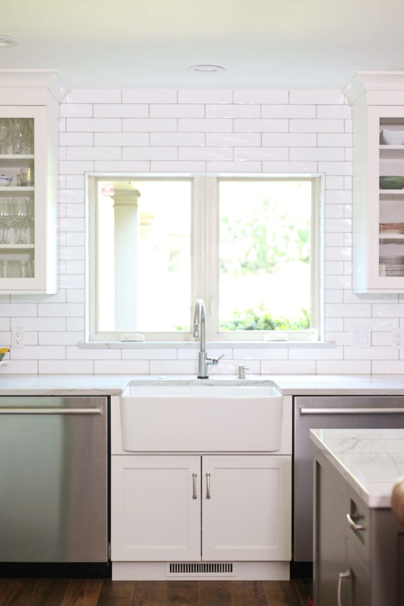 Farmhouse kitchen sink, stainless Monogram dishwasher, subway tile backsplash, white kitchen cabinet storage Kitchen Ideas Tulsa kitchen remodel