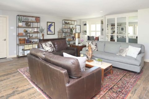 Living room sofa seating decorative shelves flush tall storage windows white cabinet shelf storage medium brown wood floors Kitchen Ideas Tulsa design and remodel