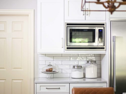 Wall microwave kitchen cabinet, drawer storage, refrigerator, subway tile backsplash, island pendants Kitchen Ideas Tulsa kitchen remodel